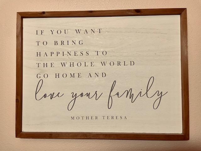 A wall Hanging Sign that Reads Love your Family