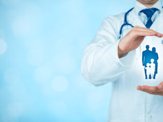 Doctor in lab coat with blue background